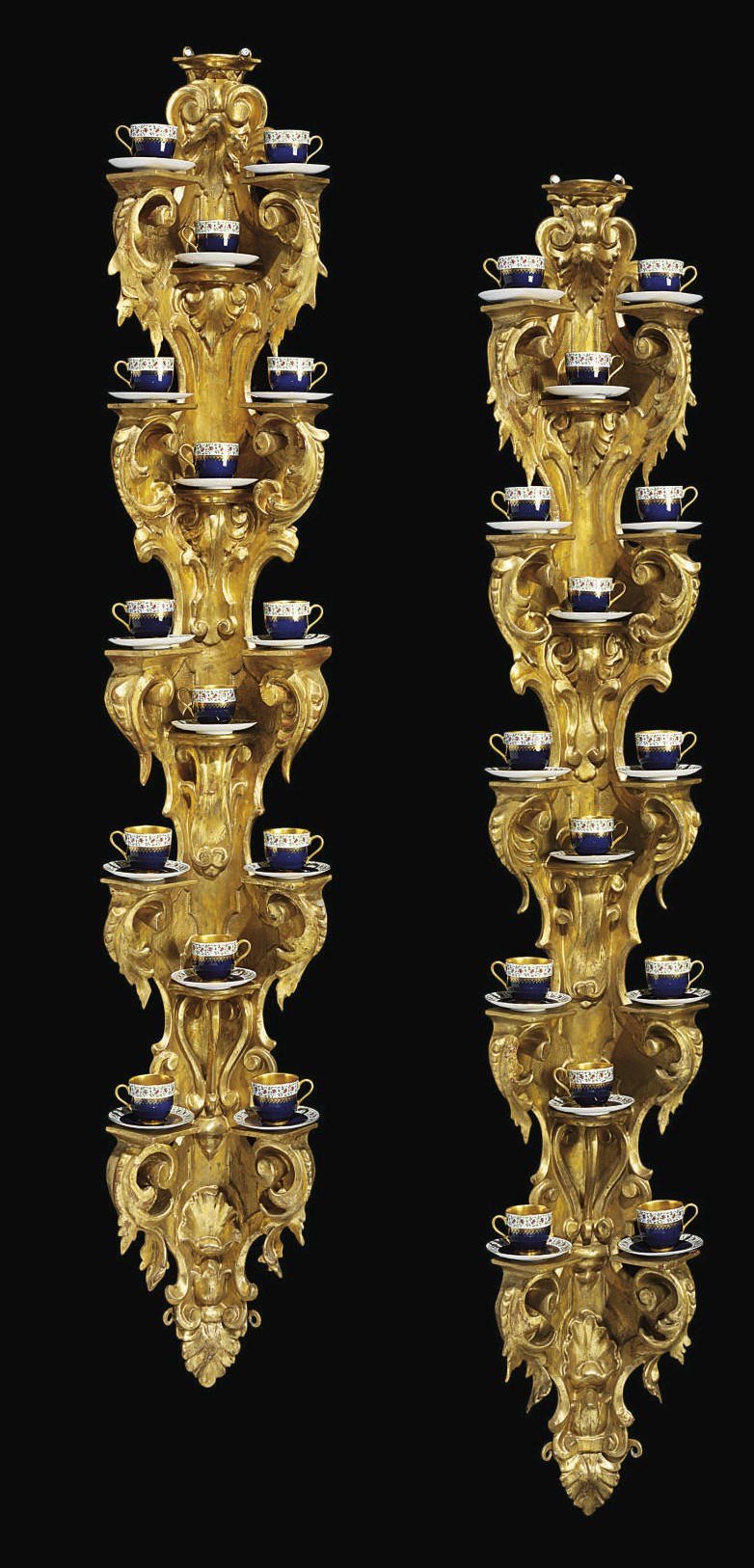 A PAIR OF ITALIAN GILTWOOD CORNER ETAGÈRES