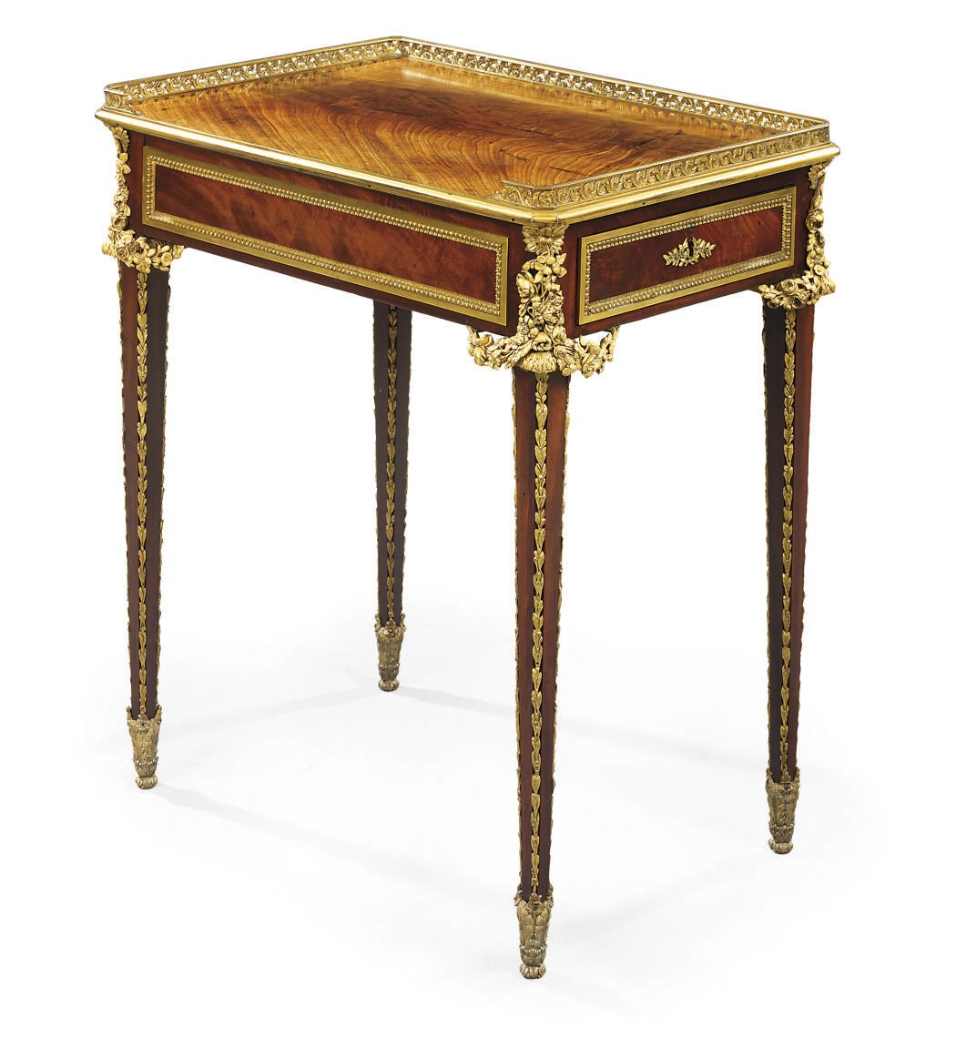 A FRENCH ORMOLU-MOUNTED MAHOGANY TABLE A ECRIRE