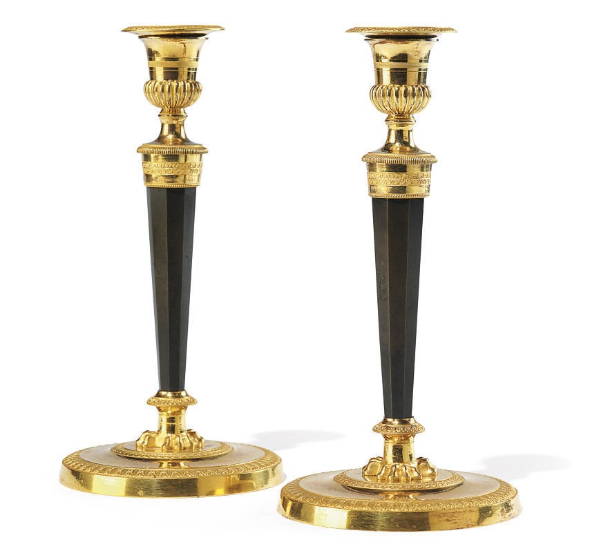 A PAIR OF EMPIRE ORMOLU AND PATINATED BRONZE CANDLESTICKS