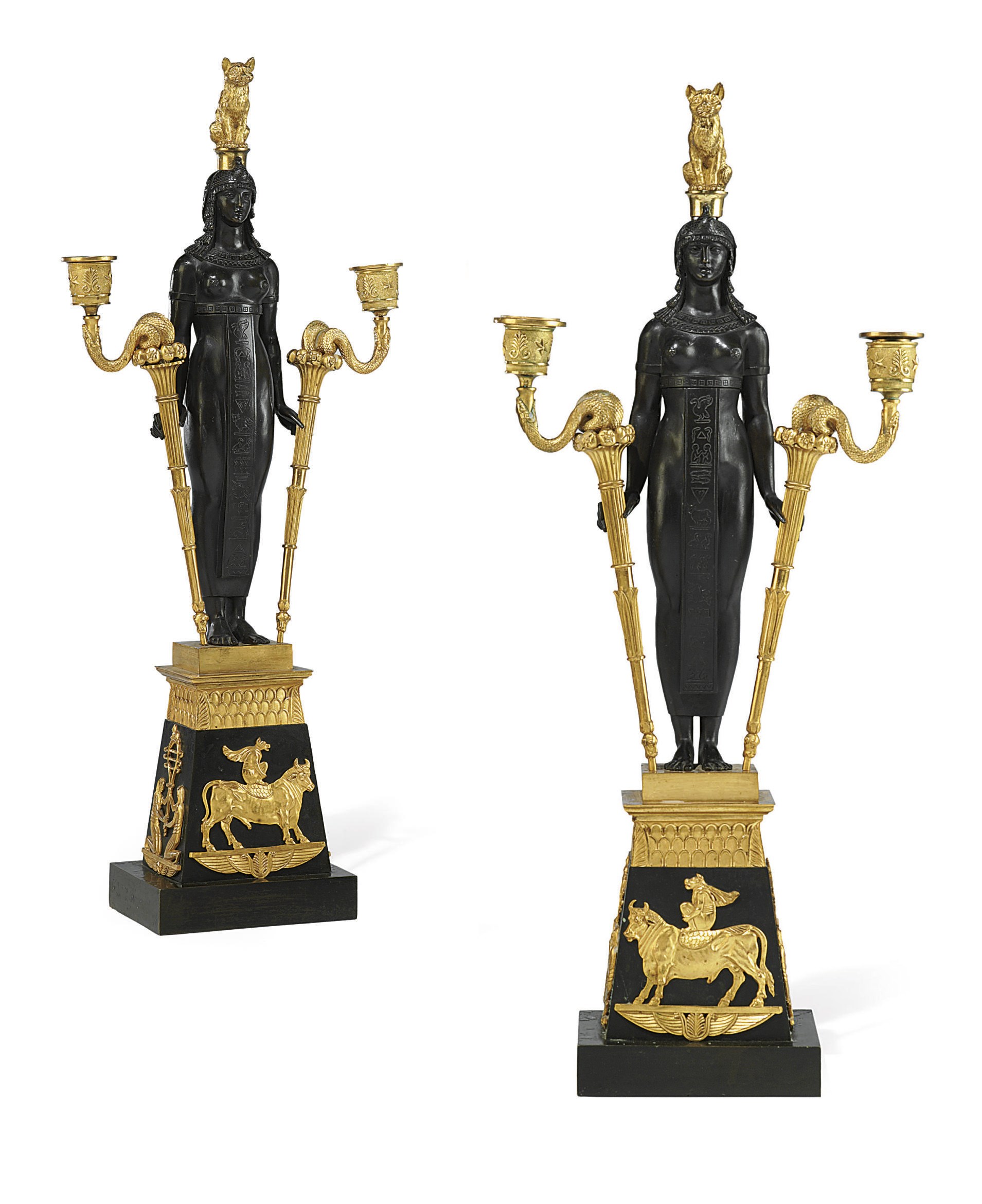 A PAIR OF EMPIRE ORMOLU AND PATINATED BRONZE TWIN-LIGHT CANDELABRA