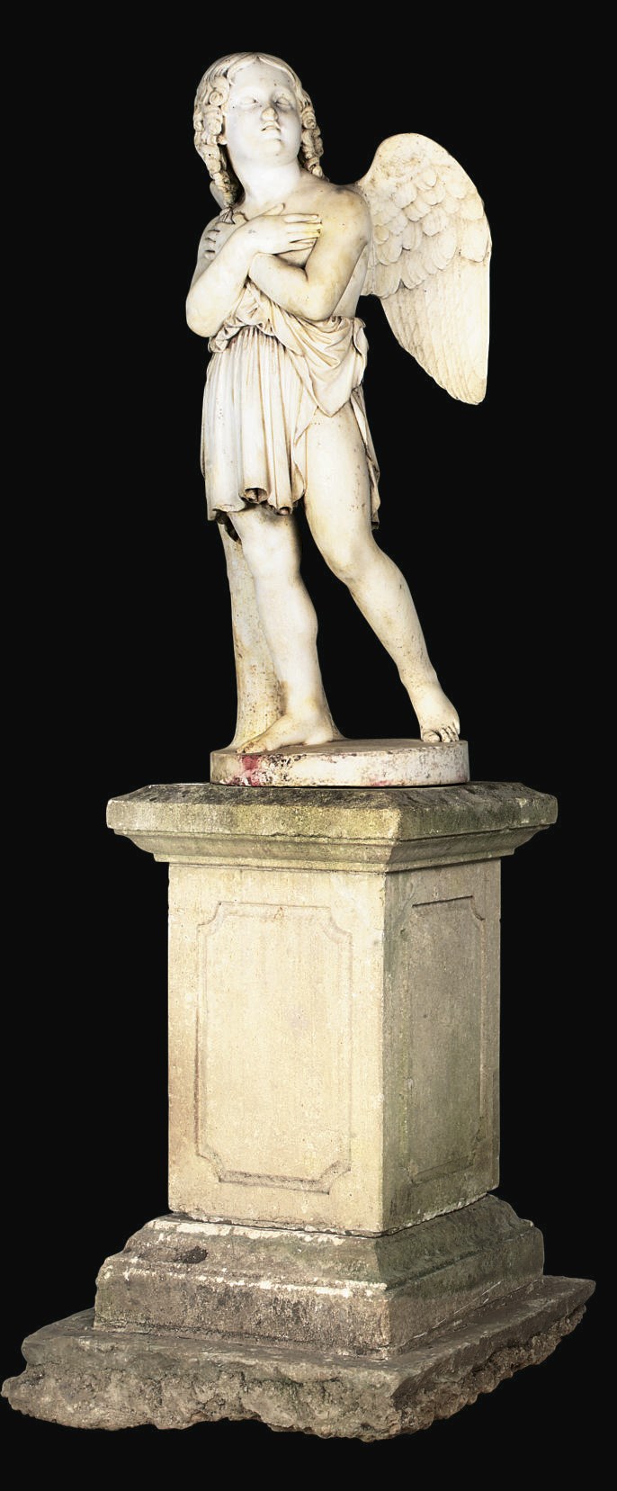 A CARVED MARBLE FIGURE OF CUPID