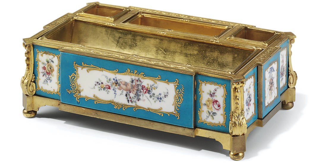 A FRENCH ORMOLU AND PORCELAIN ENCRIER