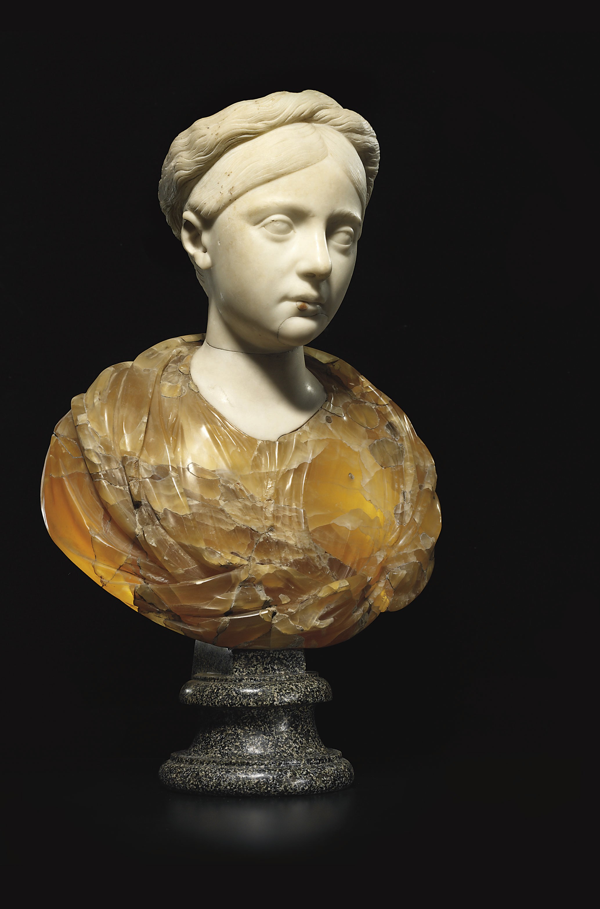 A CARVED MARBLE AND ALABASTER BUST OF A YOUNG WOMAN