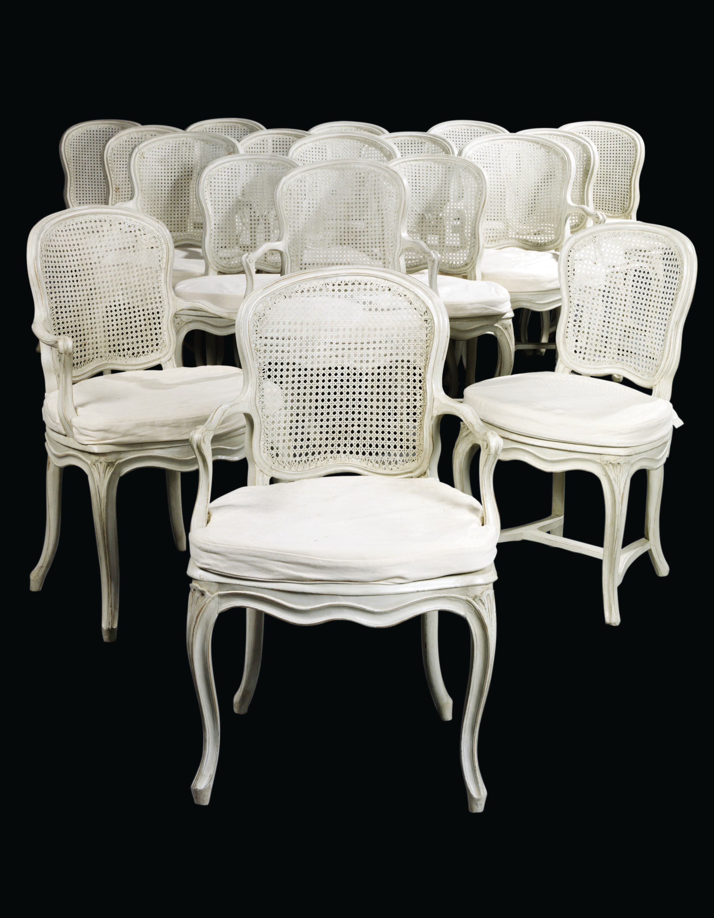 A MATCHED SET OF EIGHTEEN LOUIS XV WHITE-PAINTED CANED DINING-CHAIRS