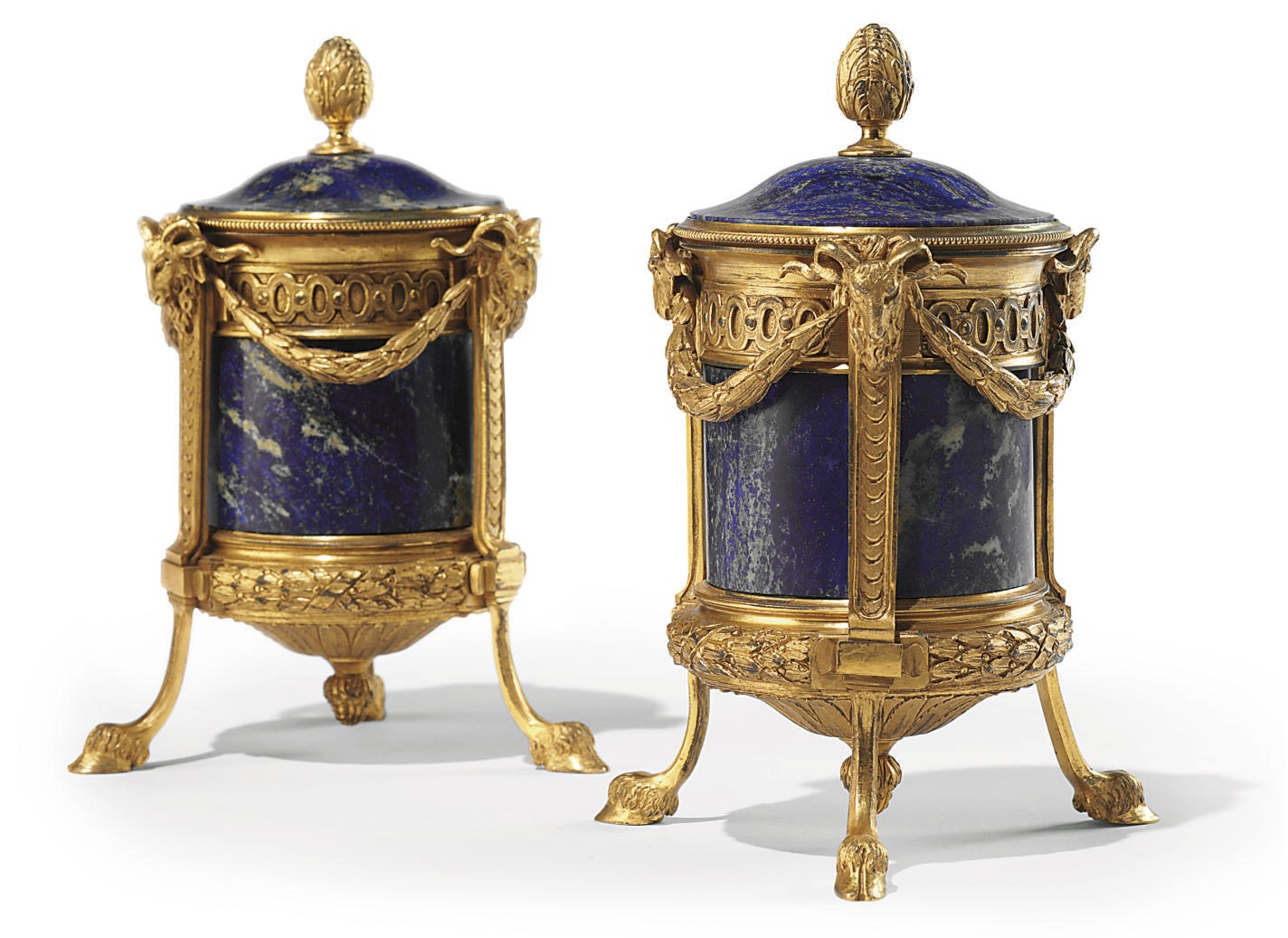A PAIR OF ITALIAN ORMOLU AND LAPIS LAZULI COVERED URNS