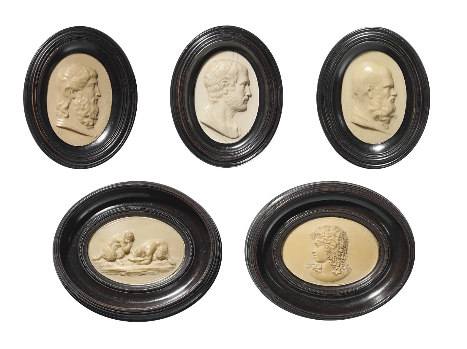 FIVE OVAL CARVED IVORY RELIEFS
