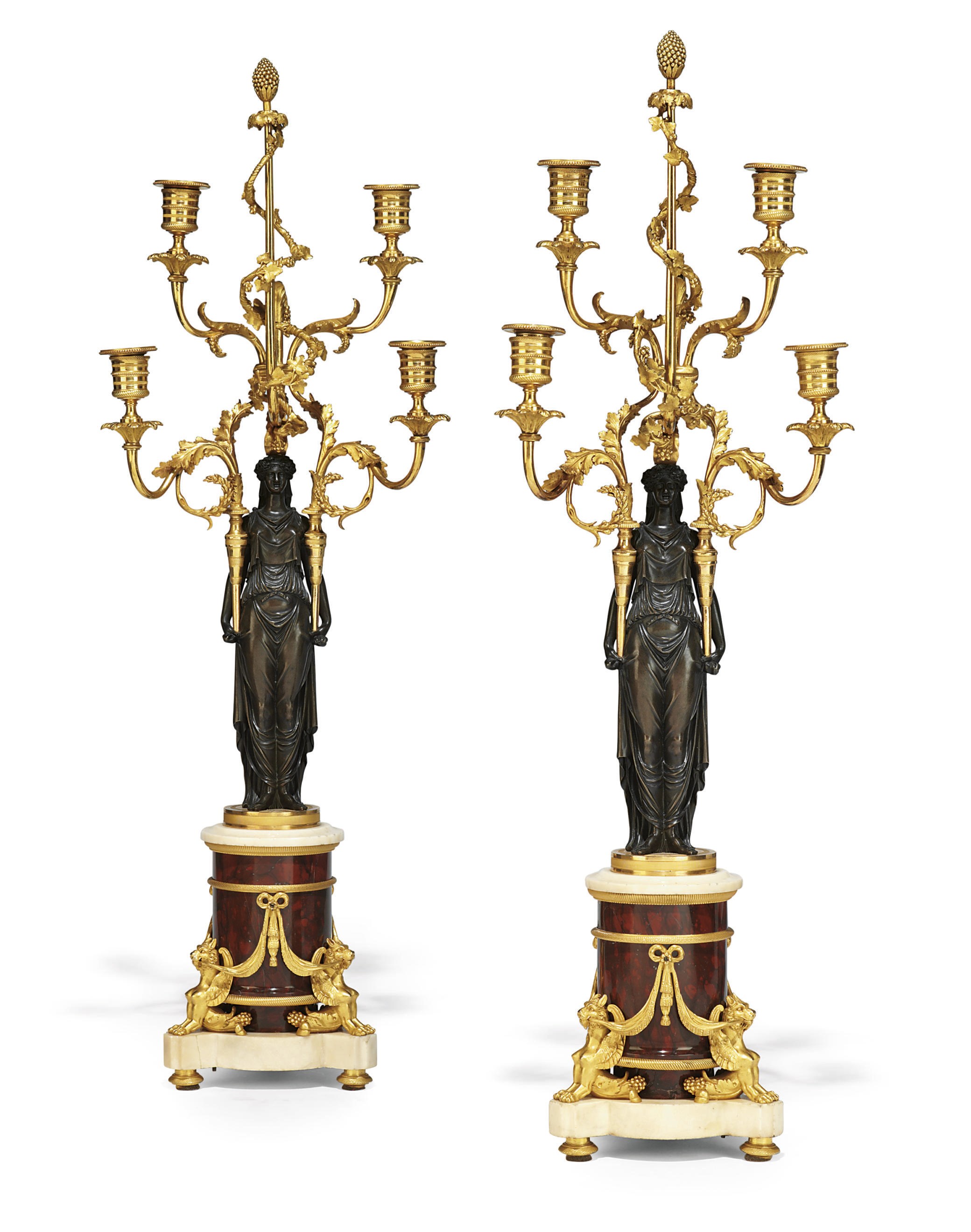 A PAIR OF LATE LOUIS XVI ORMOLU, PATINATED BRONZE, ROUGE GRIOTTE AND WHITE MARBLE FOUR-LIGHT CANDELABRA