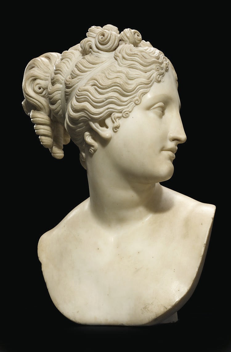 A CARVED MARBLE BUST OF VENUS