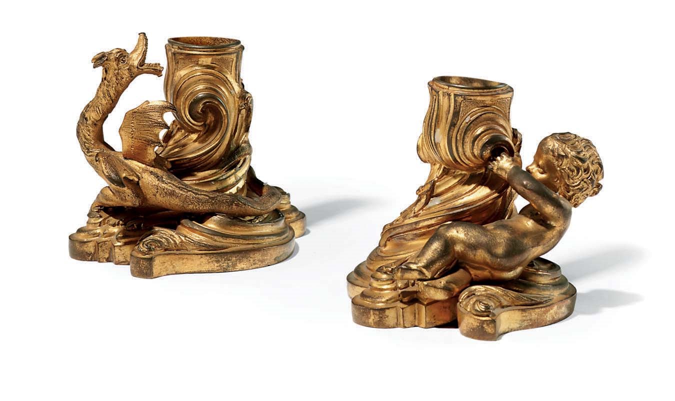 A PAIR OF FRENCH ORMOLU CANDLESTICKS