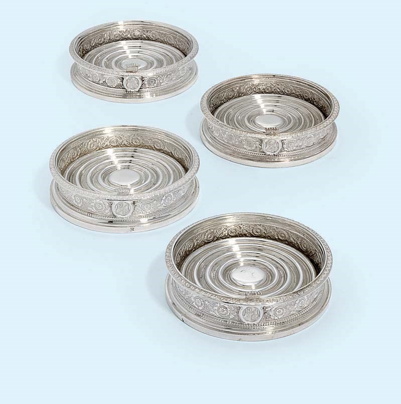 A SET OF FOUR AUSTRIAN SILVER WINE-COASTERS
