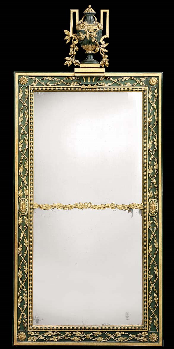 A GERMAN PARCEL-GILT AND GREEN-PAINTED MIRROR