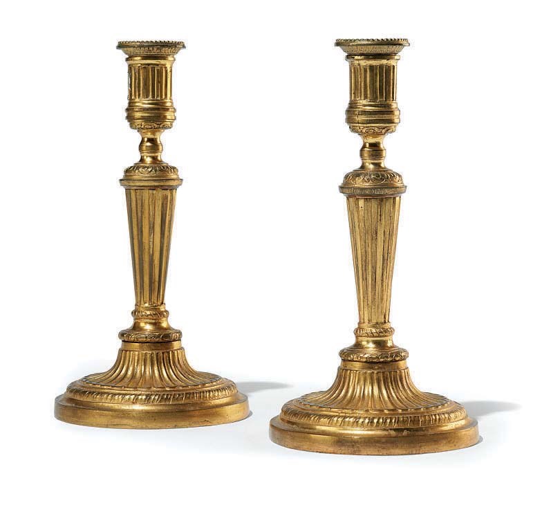 A PAIR OF LOUIS XVI ORMOLU CANDLESTICKS