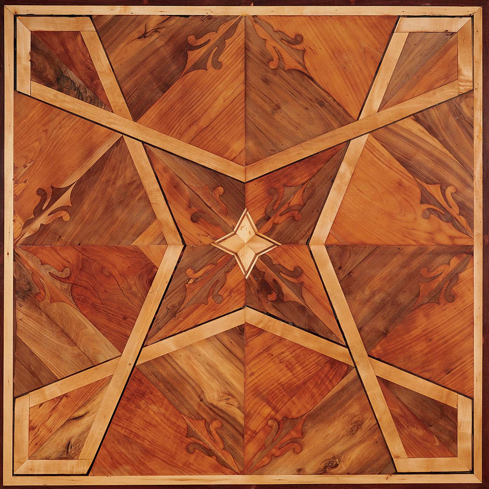 AN AUSTRIAN WALNUT, CHERRY AND FRUITWOOD PARQUETRY FLOOR