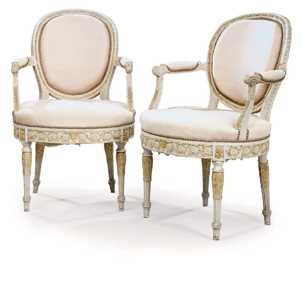 A PAIR OF LOUIS XVI WHITE PAINTED AND PARCEL-GILT FAUTEUILS