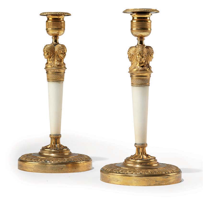 A PAIR OF EMPIRE ORMOLU AND WHITE MARBLE CANDLESTICKS