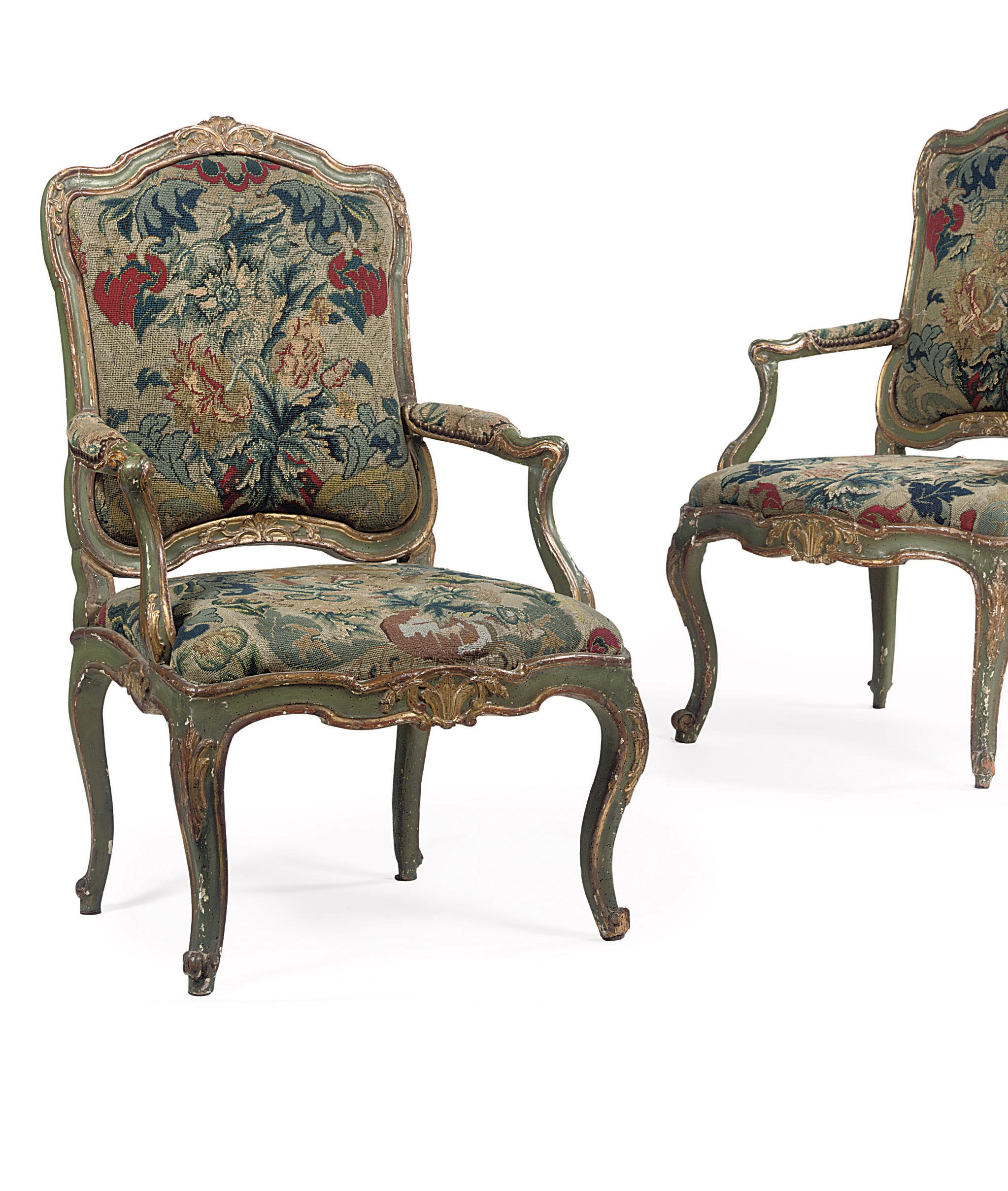 A pair of South-Italian parcel-gilt and white painted fauteuils a chassis