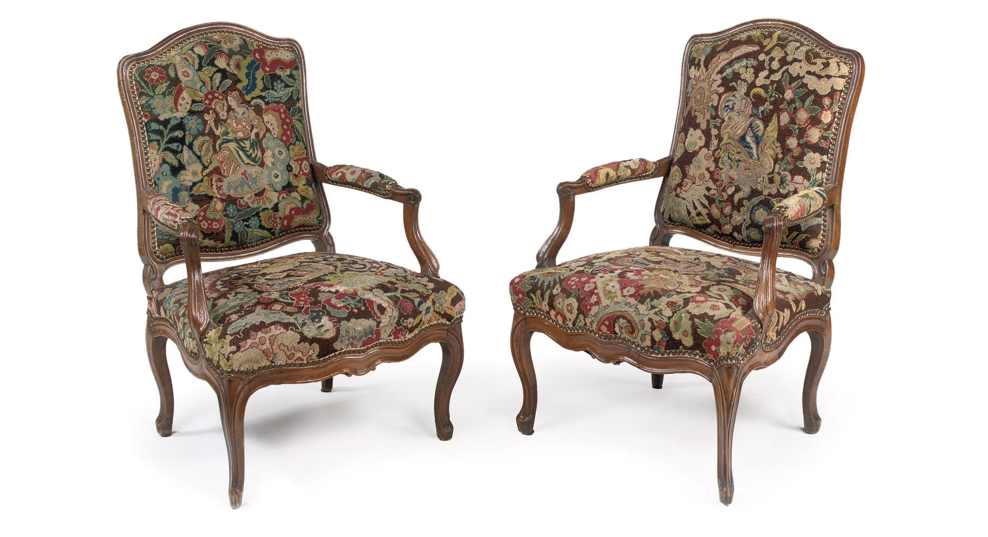 A pair of Louis XV walnut fauteuils