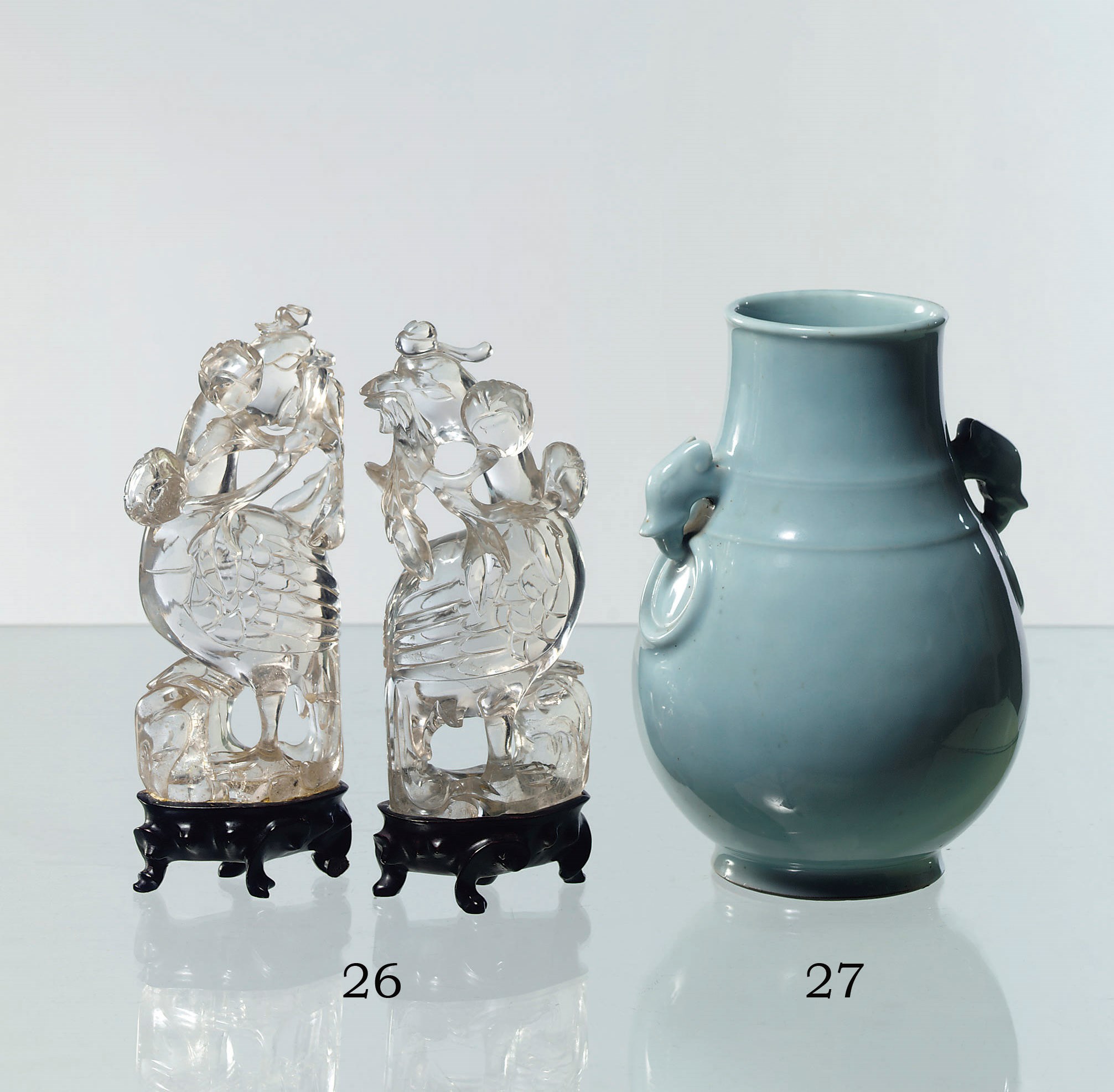 A pair of Chinese rock crystal carvings of phoenix