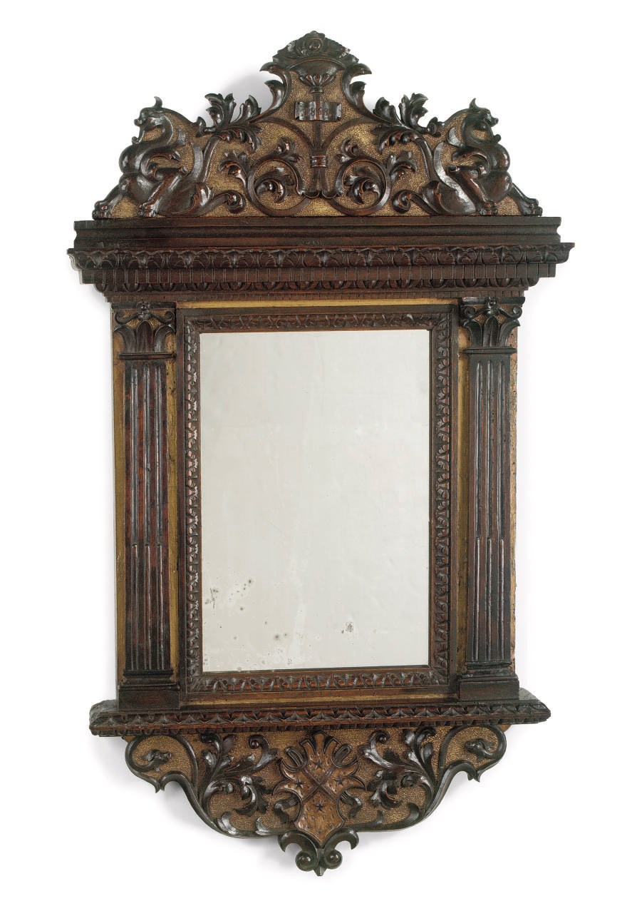 An Italian parcel-gilt and walnut mirror