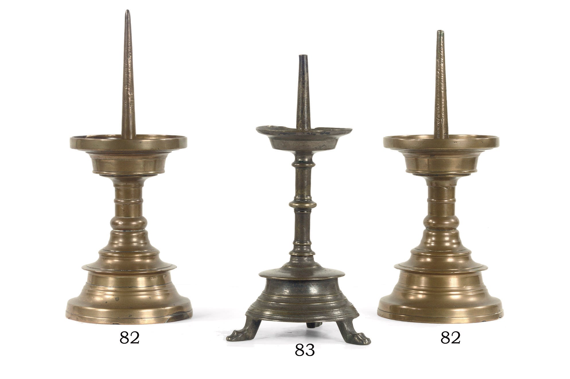 A PAIR OF BRASS CANDLESTICKS