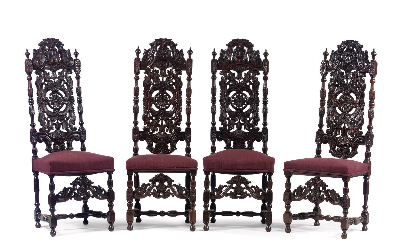A set of four neo-renaissance carved walnut highback chairs