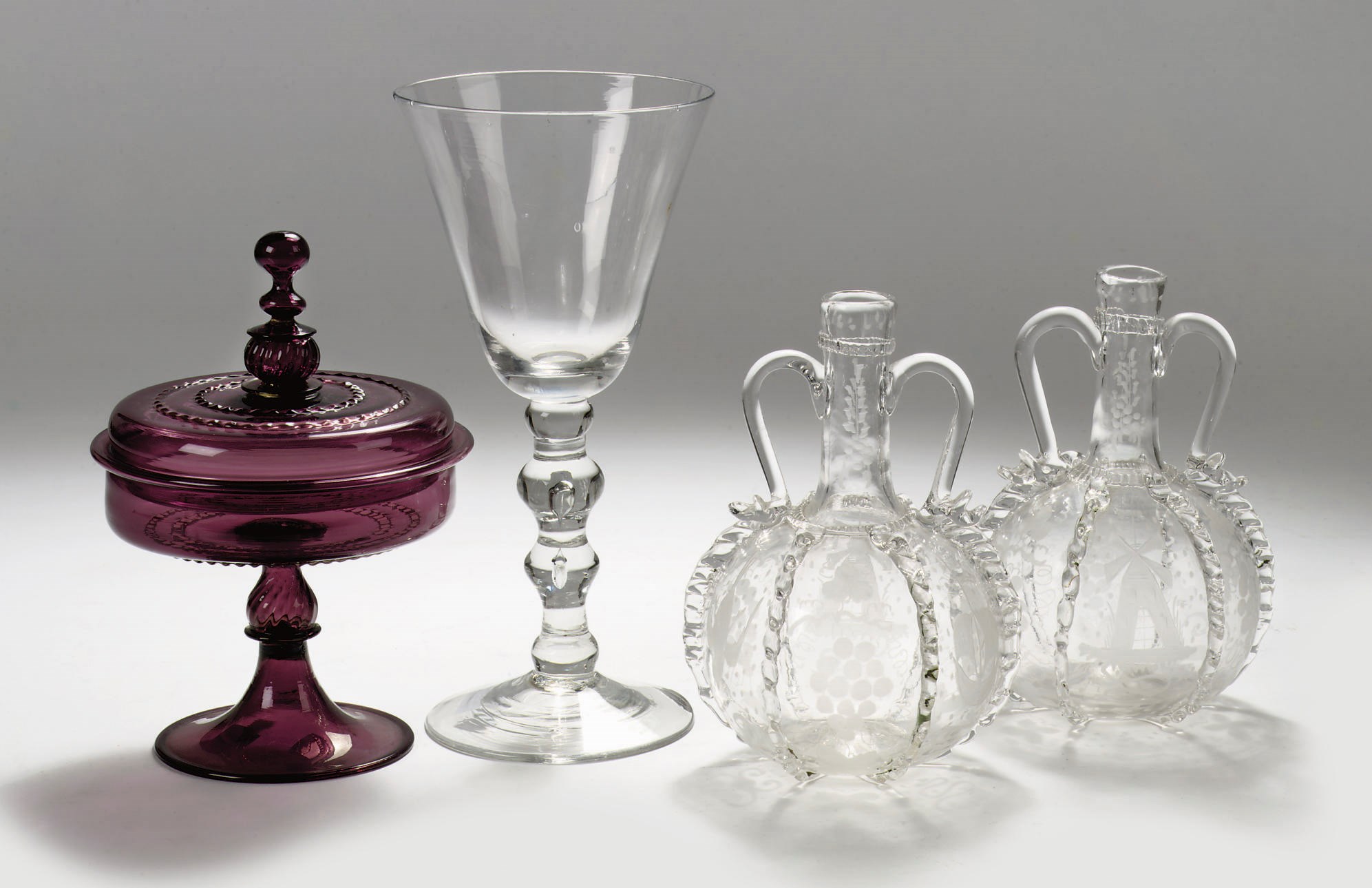 A Dutch goblet, a Facon-de-Venise glass stembowl and cover and a pair of pincerred bottles