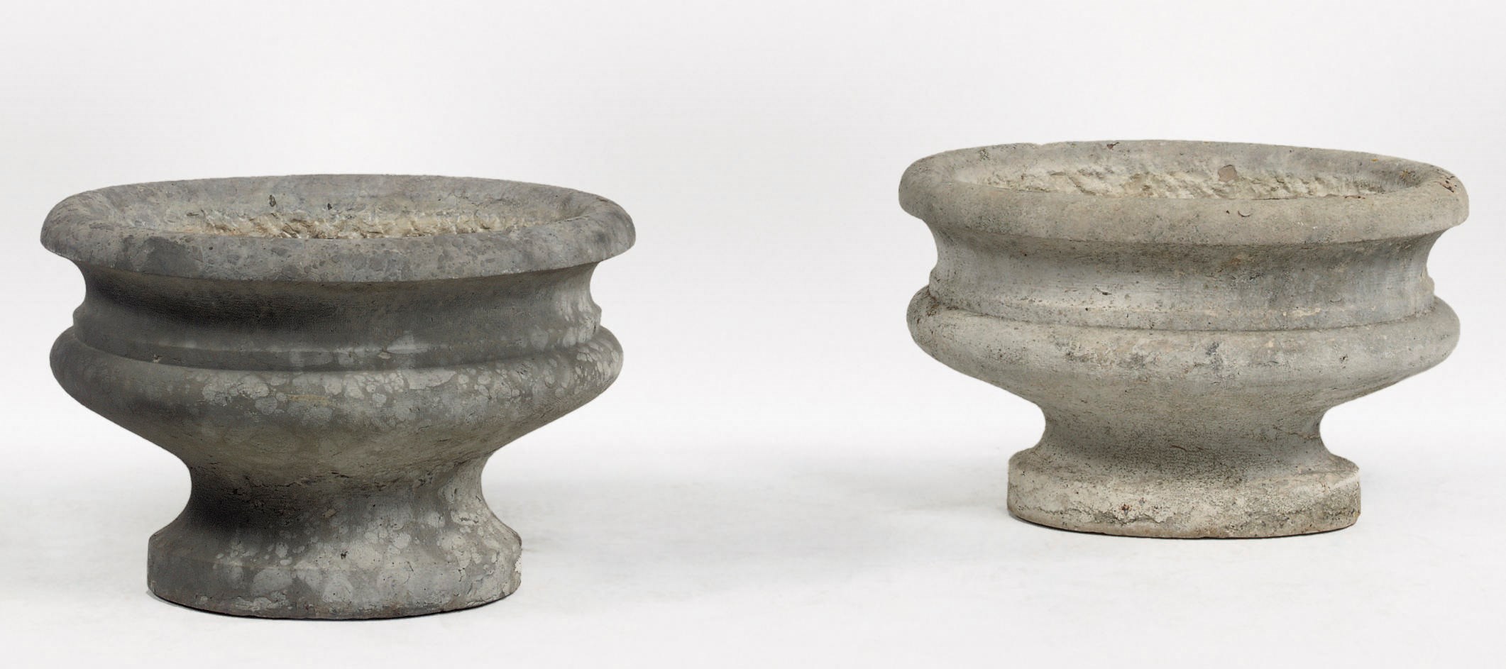 A matched pair of Italian carved stone oval vases