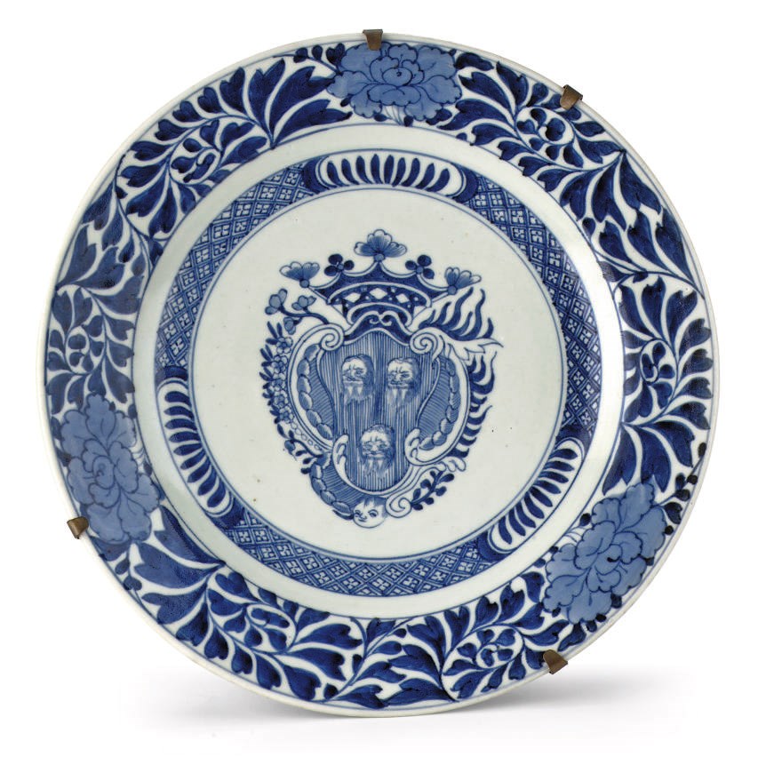 A Japanese Arita blue and white armorial dish