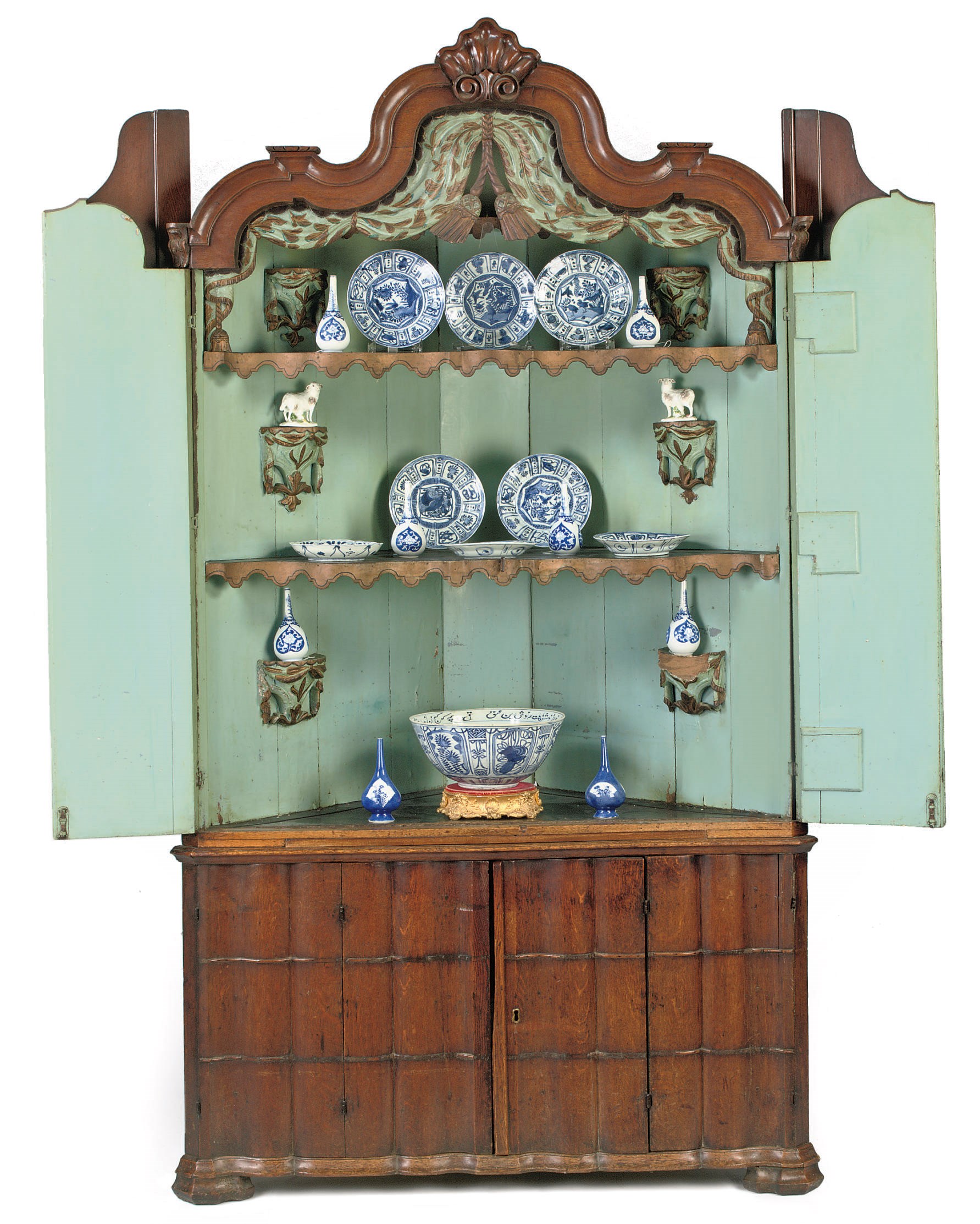 A Dutch oak corner cabinet