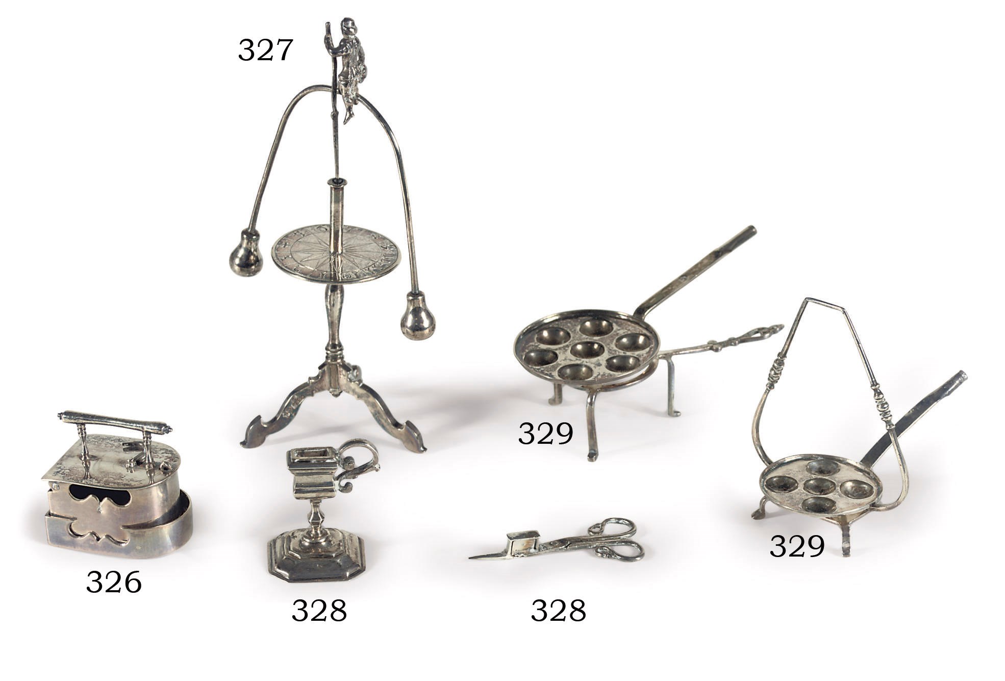 A Dutch silver miniature iron on trivet