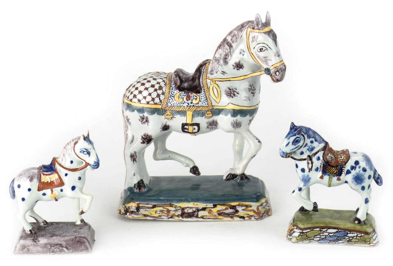 A group of three Dutch Delft polychrome caparisoned horses