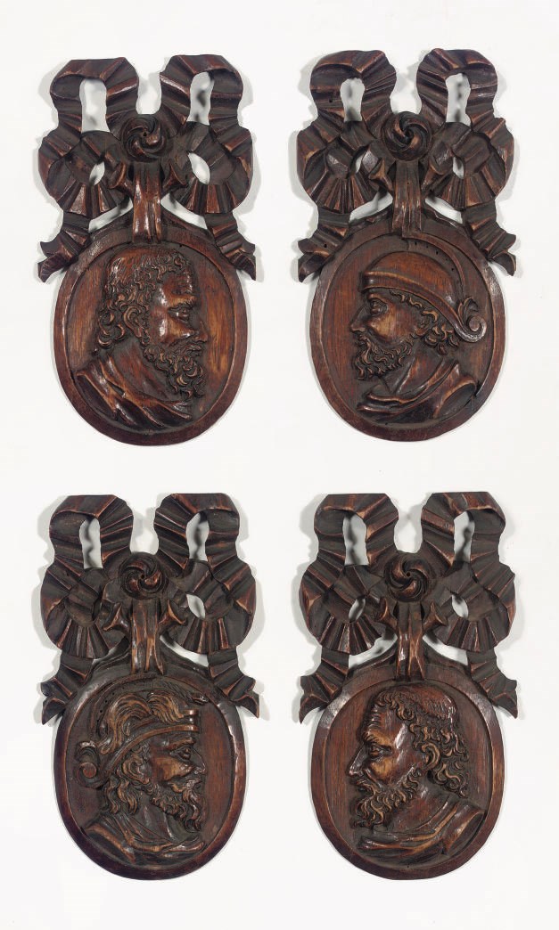A set of four Dutch carved wood medallions