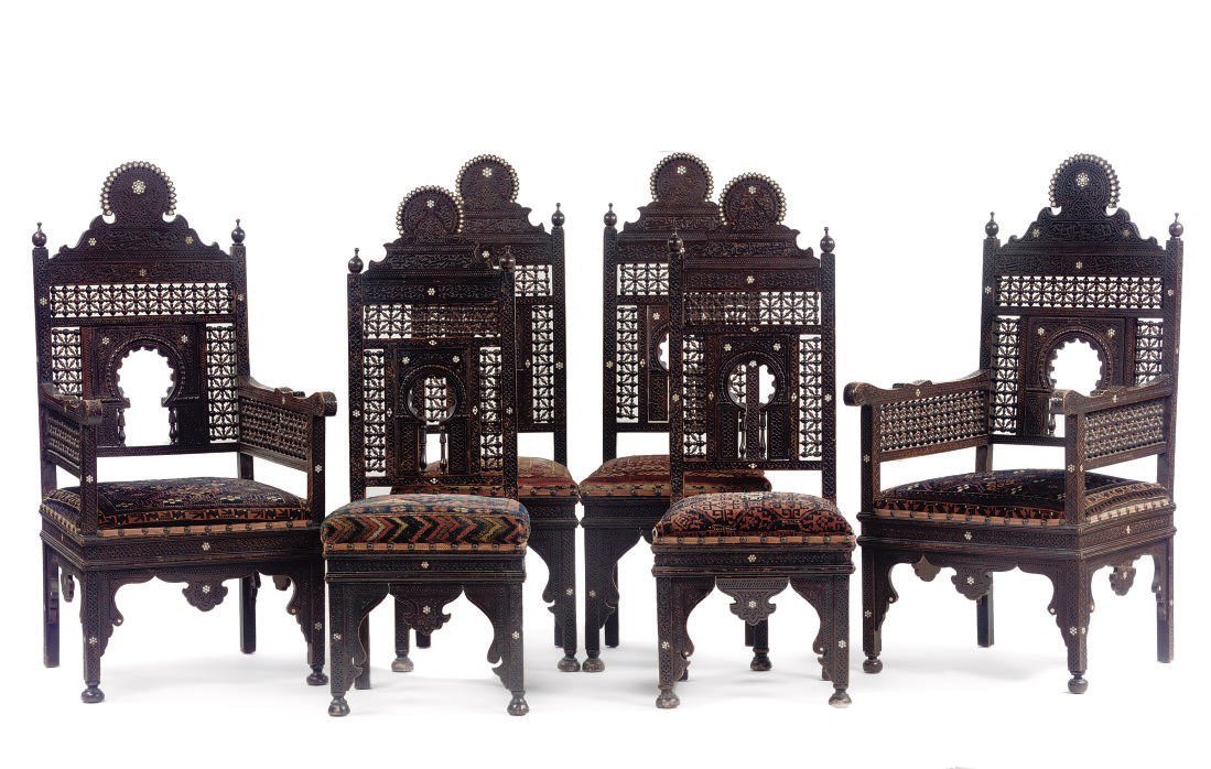 A SET OF SIX MOTHER-OF-PEARL INLAID CARVED STAINED-WALNUT CHAIRS