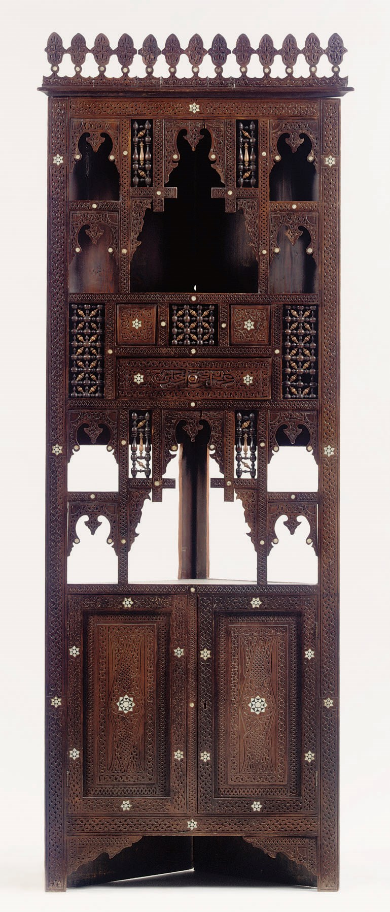 A MOTHER-OF-PEARL INLAID CARVED AND STAINED WOOD CORNER CUPBOARD