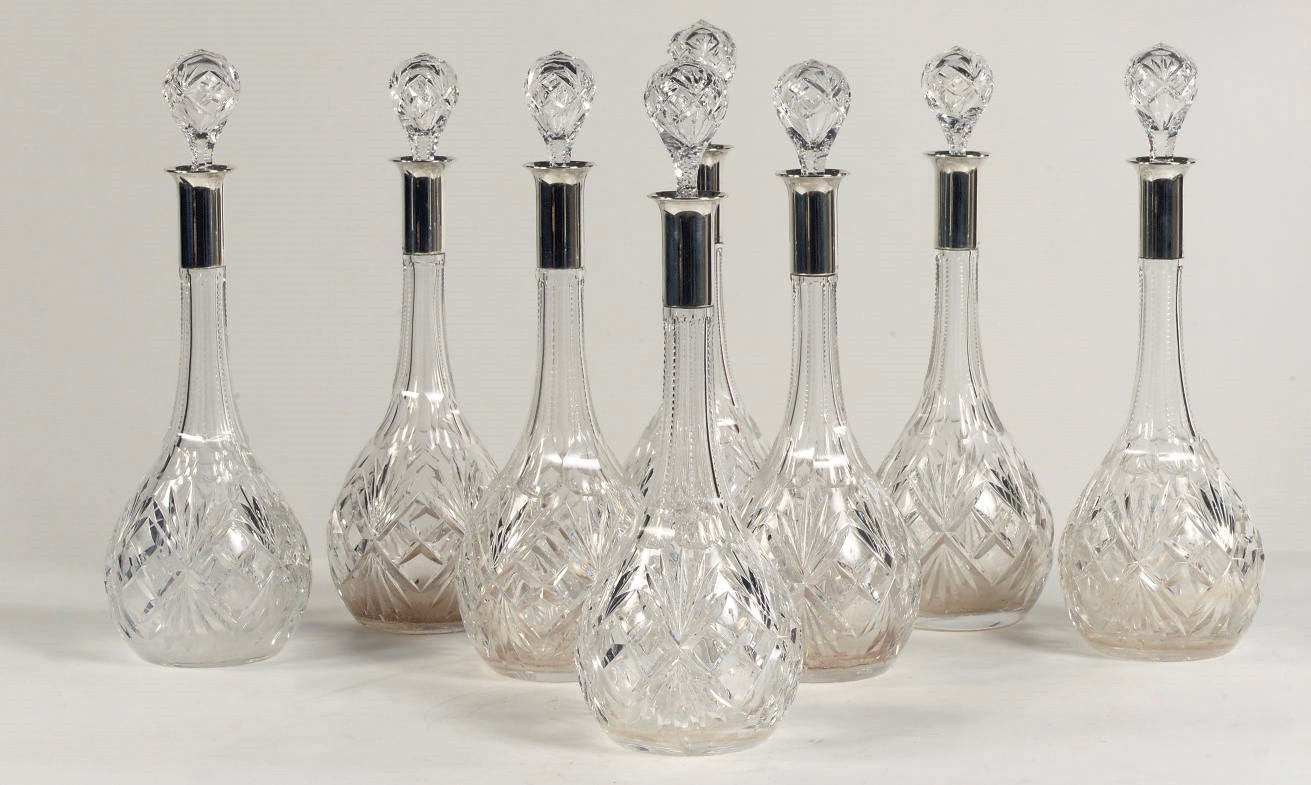 A set of eight German cut-glass silver-mounted decanters