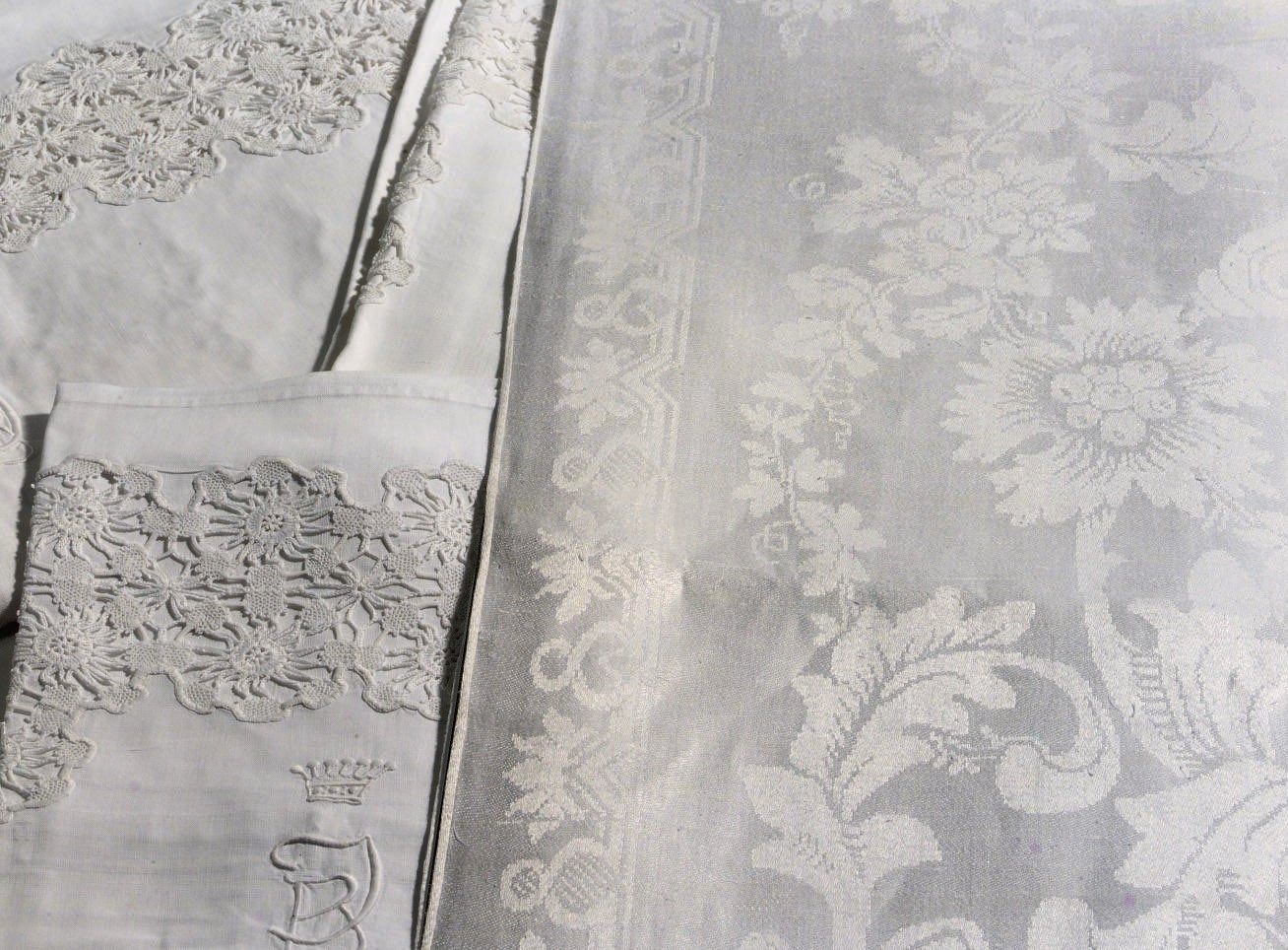 Five damask linen tablecloths