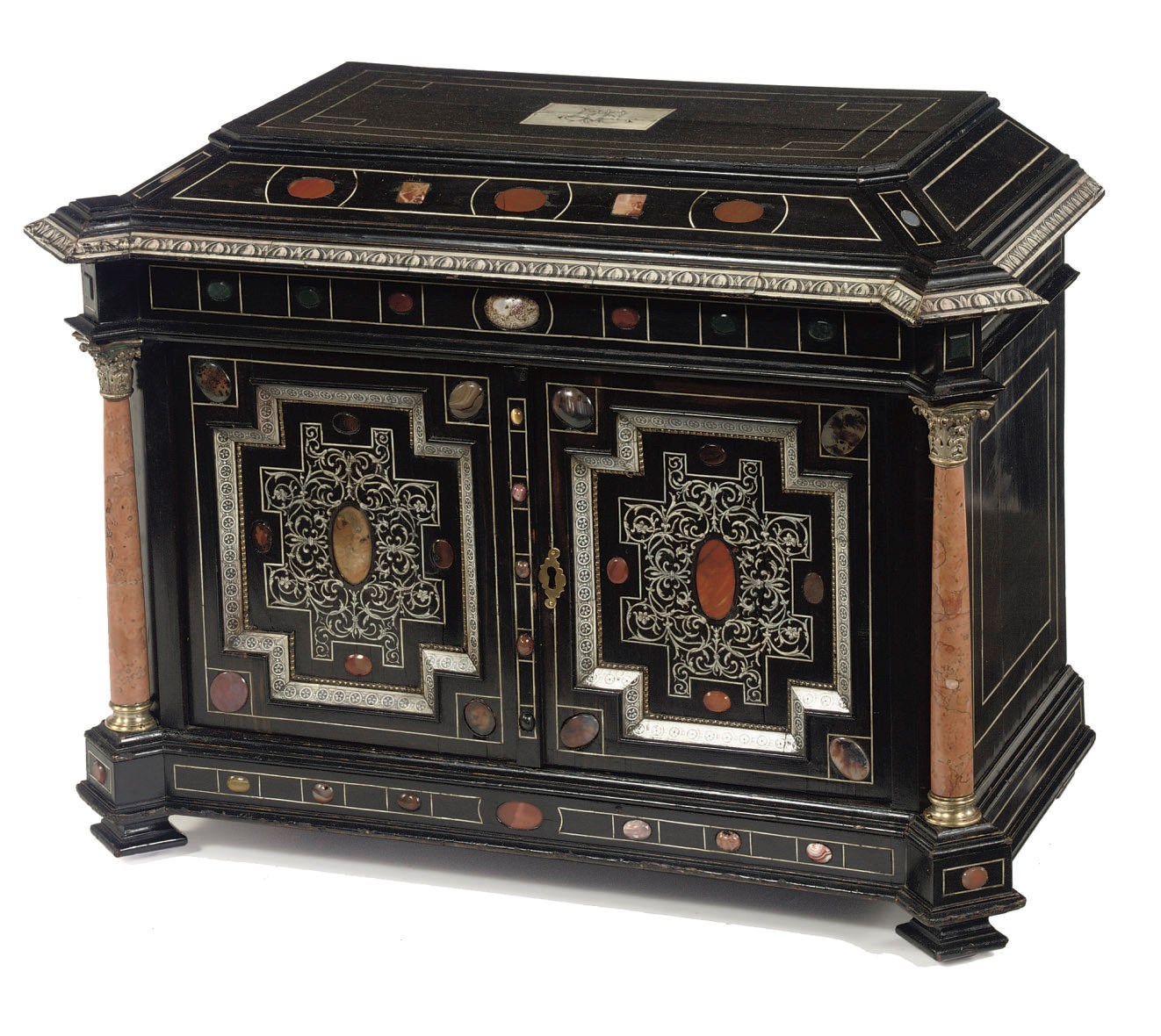 An Italian white metal mounted ebony, engraved ivory, specimen marble and semi-precious stone inset table cabinet