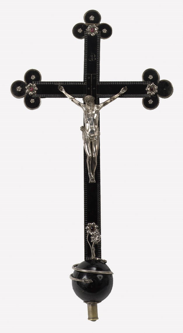 A large silver and black wooden processional crucifix