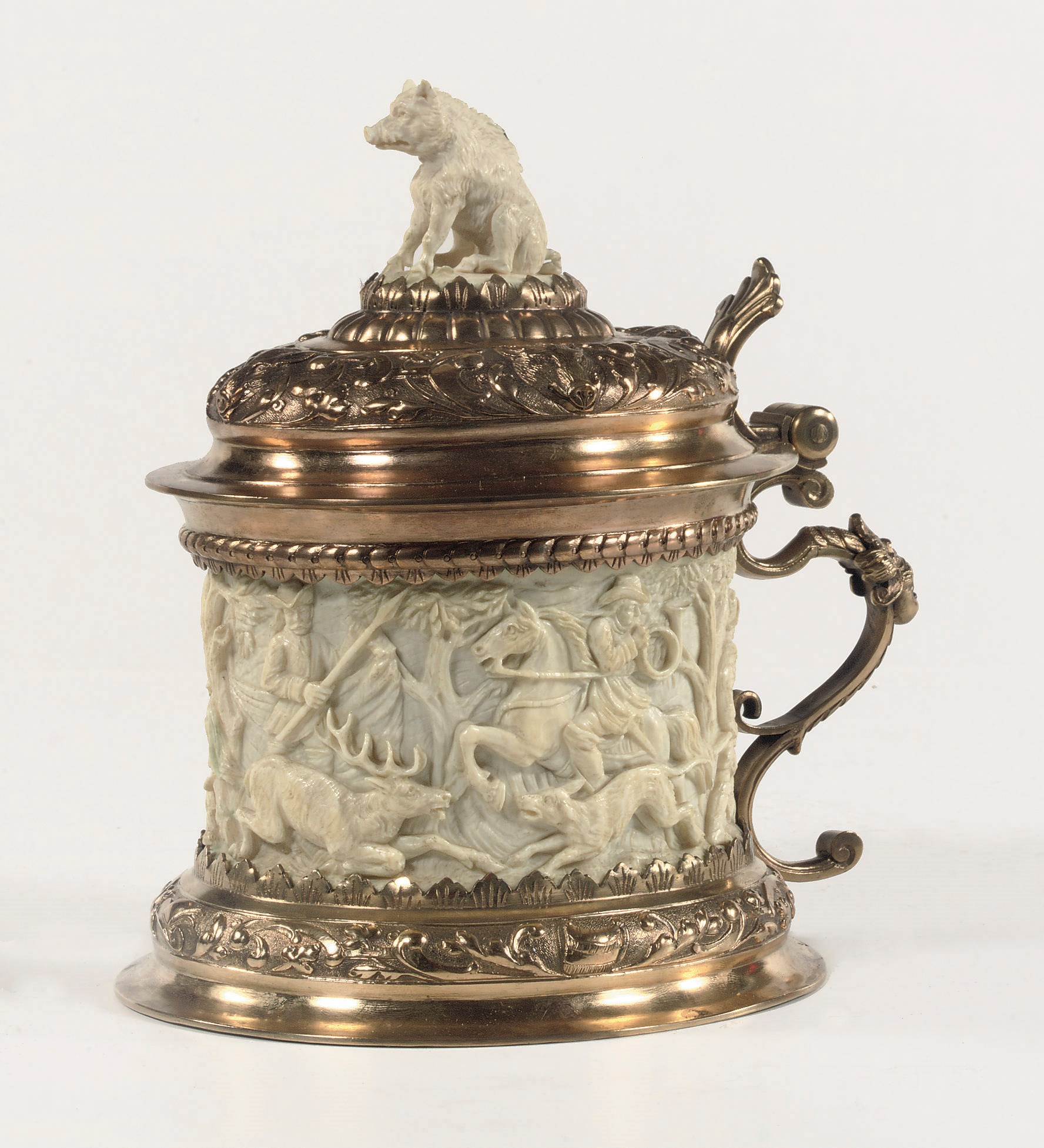 A GERMAN GILT BRASS AND RELIEF CARVED IVORY TANKARD