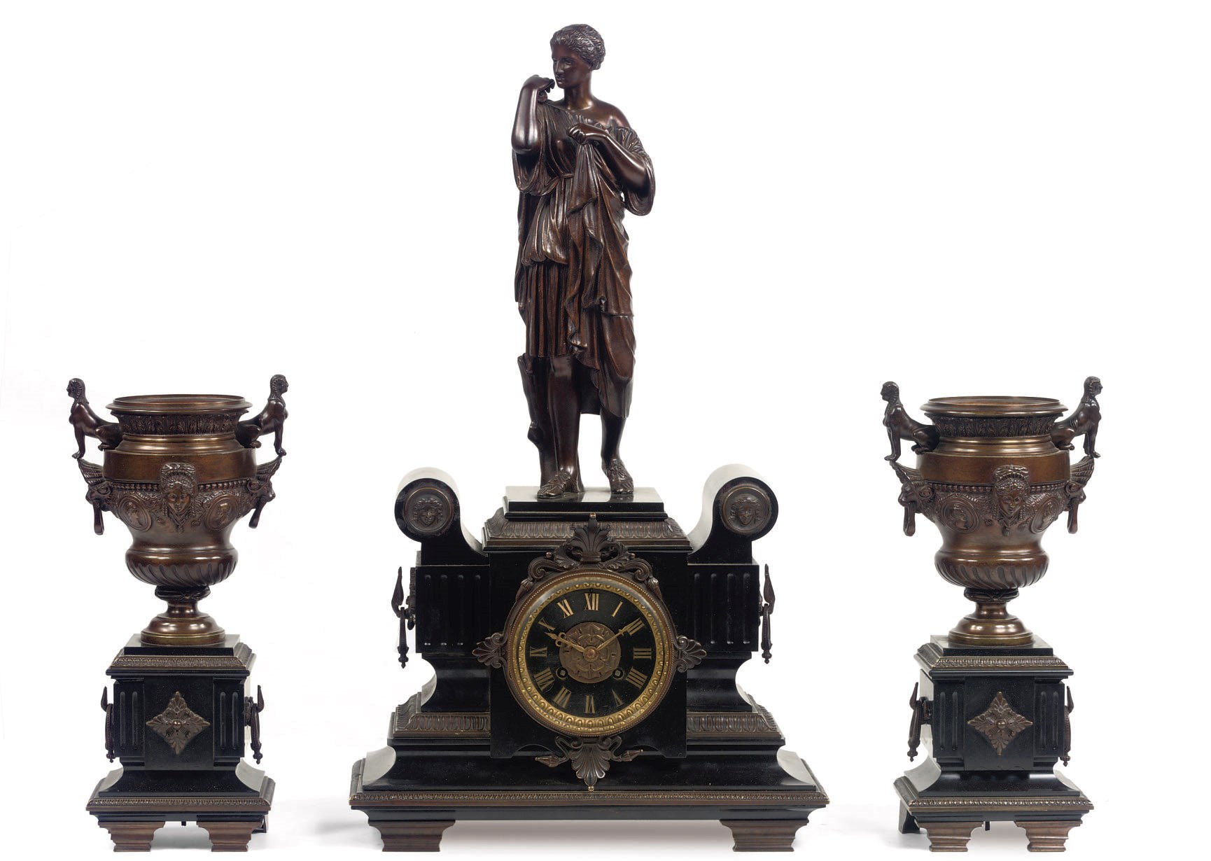 A NAPOLEON III PATINATED BRONZE AND BLACK MARBLE THREE-PIECE CLOCK GARNITURE