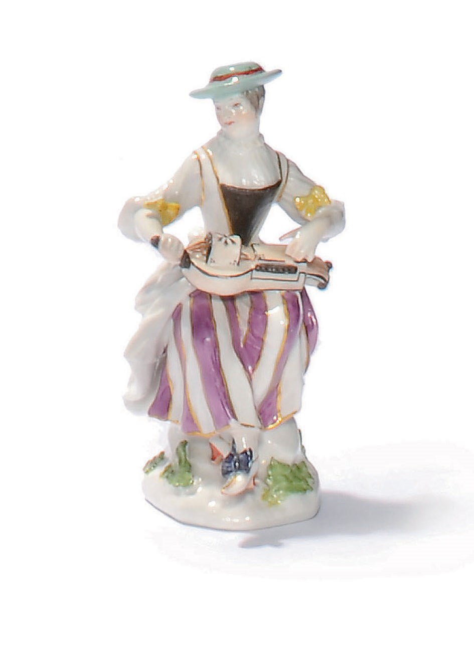 A MEISSEN FIGURE OF COLUMBINE FROM THE COMMEDIA DELL'ARTE