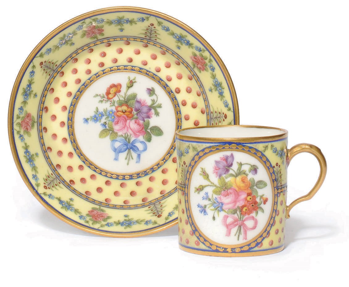 A SEVRES YELLOW-GROUND COFFEE-CAN AND SAUCER