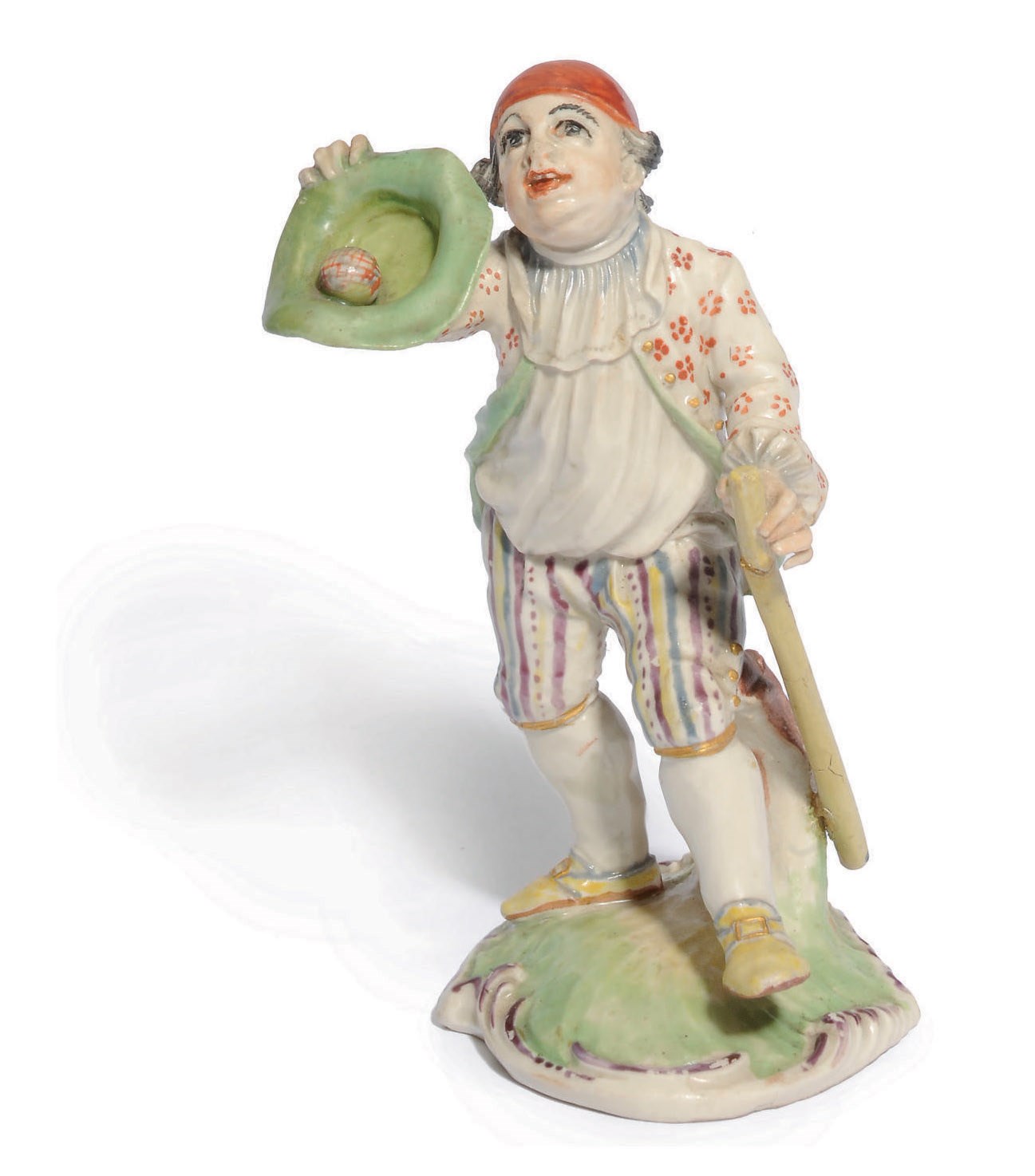 A KELSTERBACH FIGURE OF A BOY PLAYING BALL