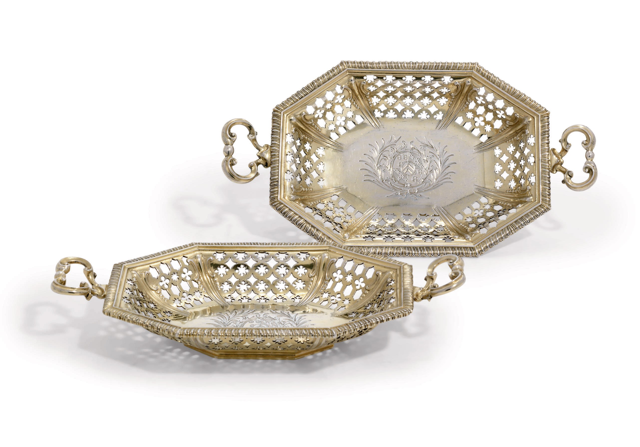 A PAIR OF GEORGE III SILVER-GILT DRESSING-TABLE DISHES FROM THE HEATHCOTE MOYER DRESSING-TABLE SERVICE