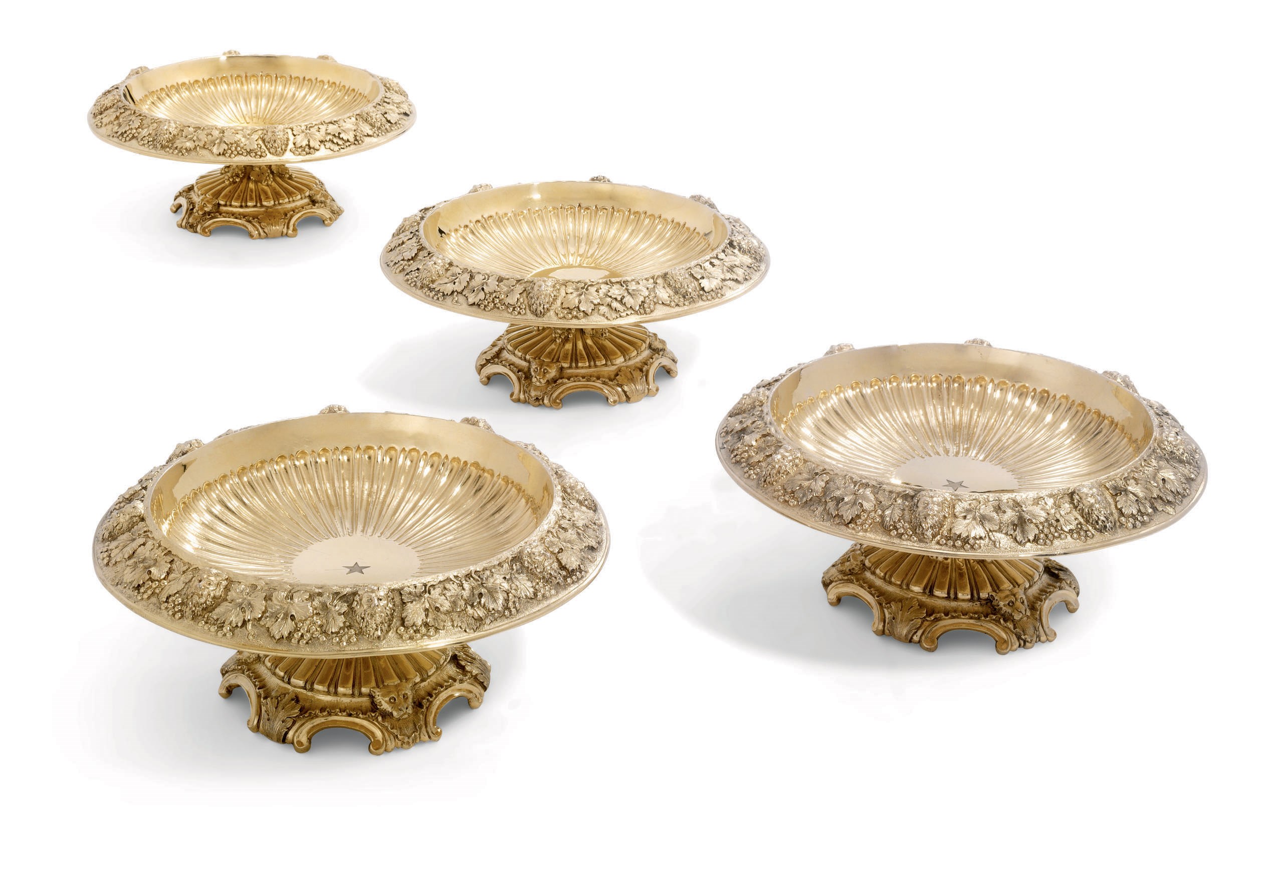 A PAIR OF VICTORIAN SILVER-GILT DESSERT-STANDS AND A PAIR OF GEORGE V SILVER-GILT DESSERT-STANDS MADE TO MATCH