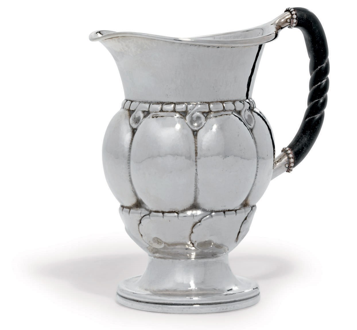A DANISH WATER-PITCHER DESIGNED BY GEORG JENSEN