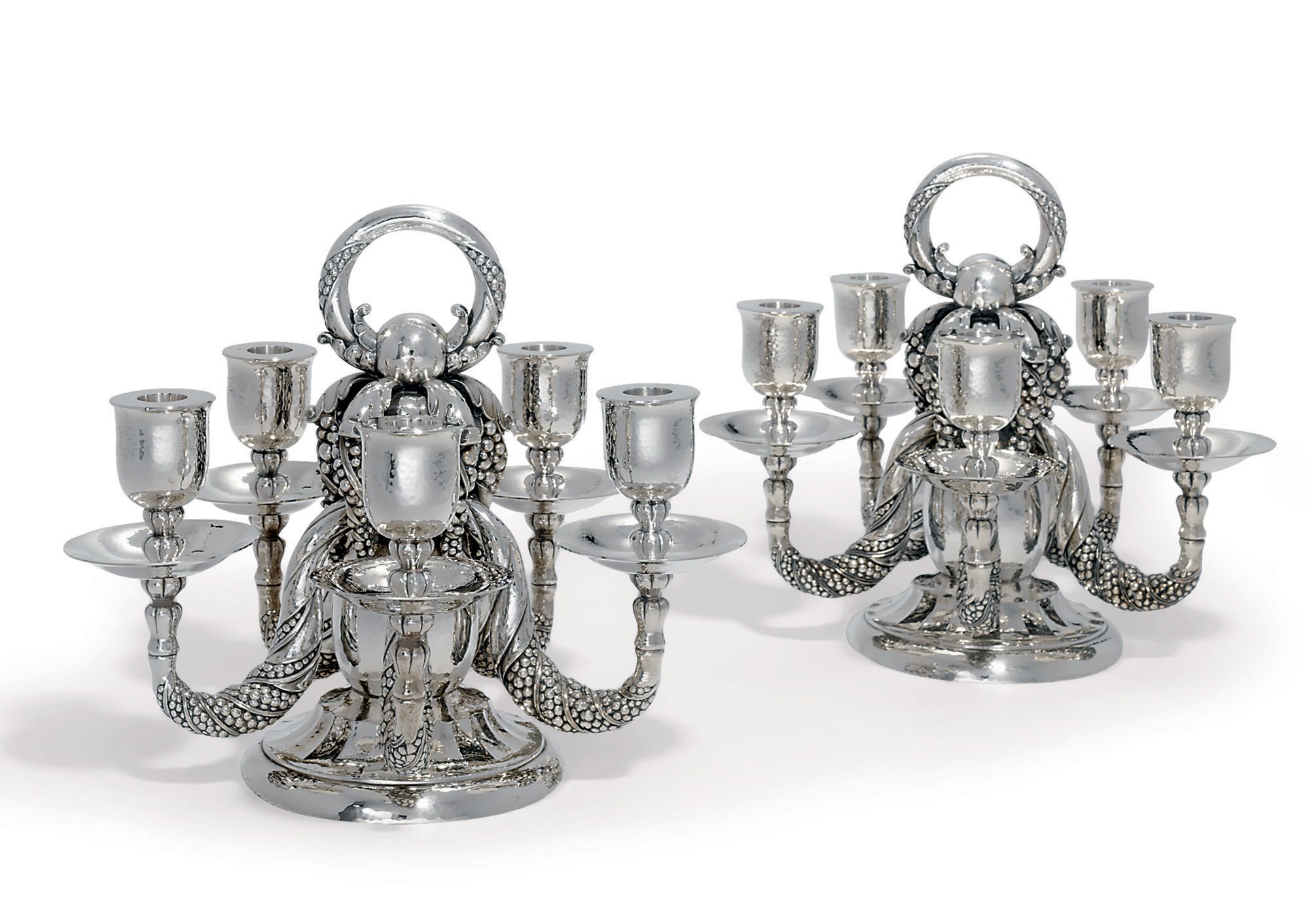 A PAIR OF DANISH FIVE-LIGHT CANDELABRA DESIGNED BY GEORG JENSEN