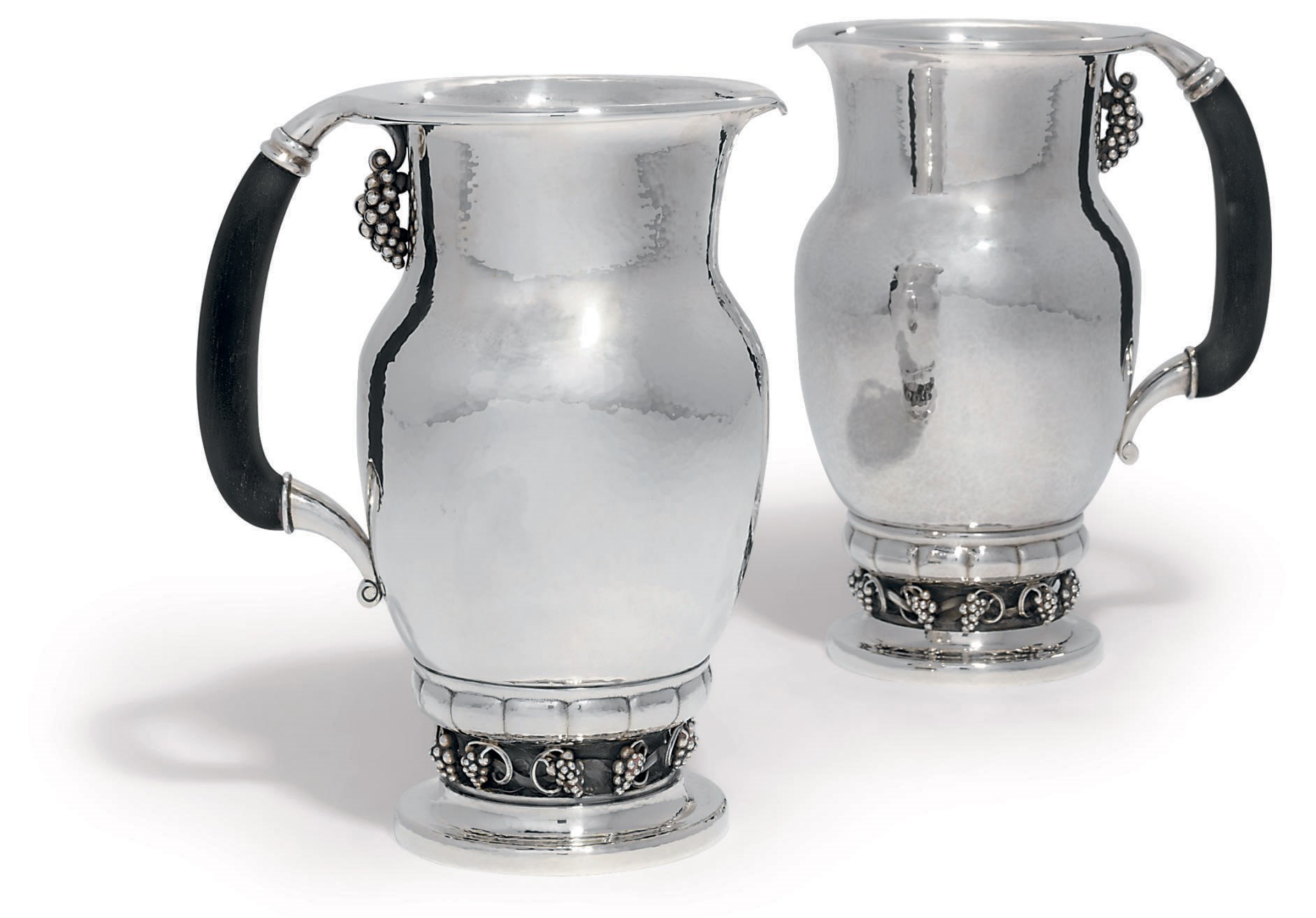 TWO DANISH WATER-PITCHERS DESIGNED BY GEORG JENSEN