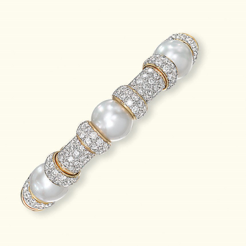 A CULTURED PEARL AND DIAMOND BANGLE