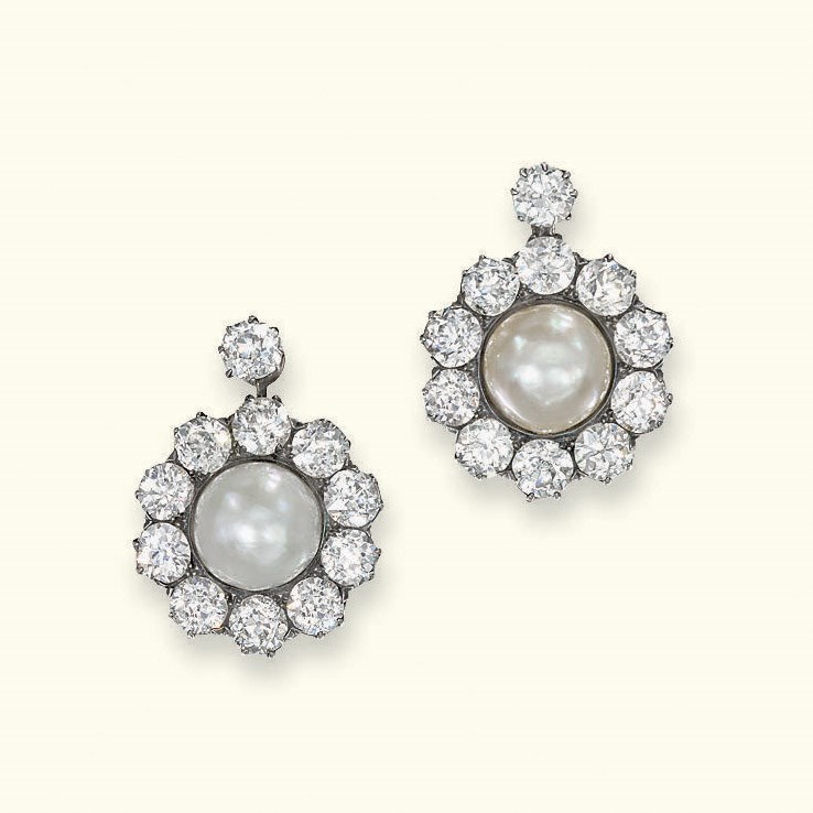 A PAIR OF NATURAL PEARL AND DIAMOND EAR CLIPS